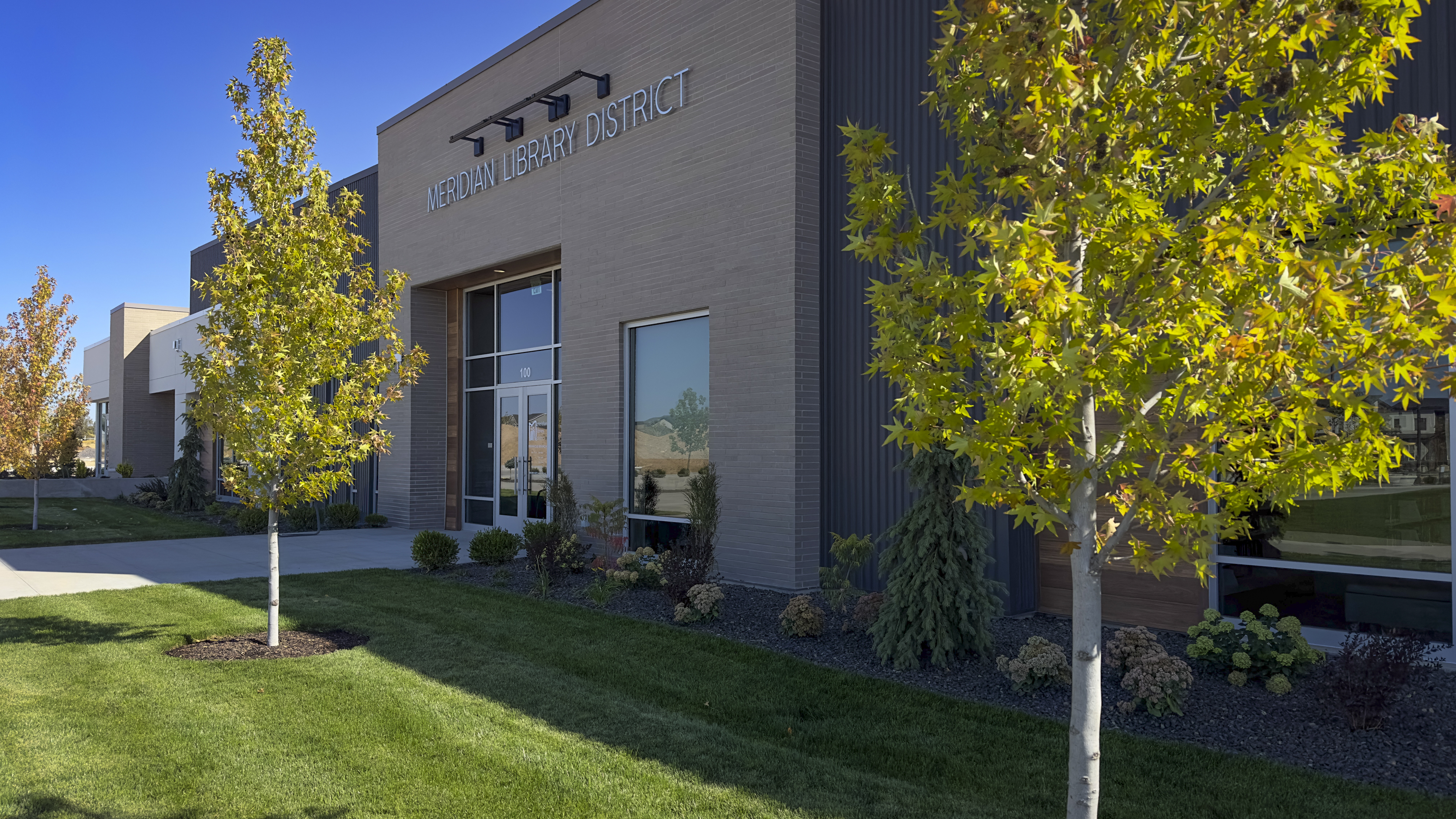 Pinnacle exterior building with golden leaves on trees